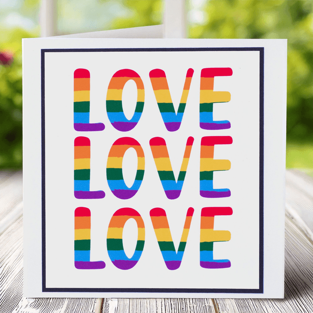 Greetings Card with Love Love Love pride theme in vibrant rainbow tones. 